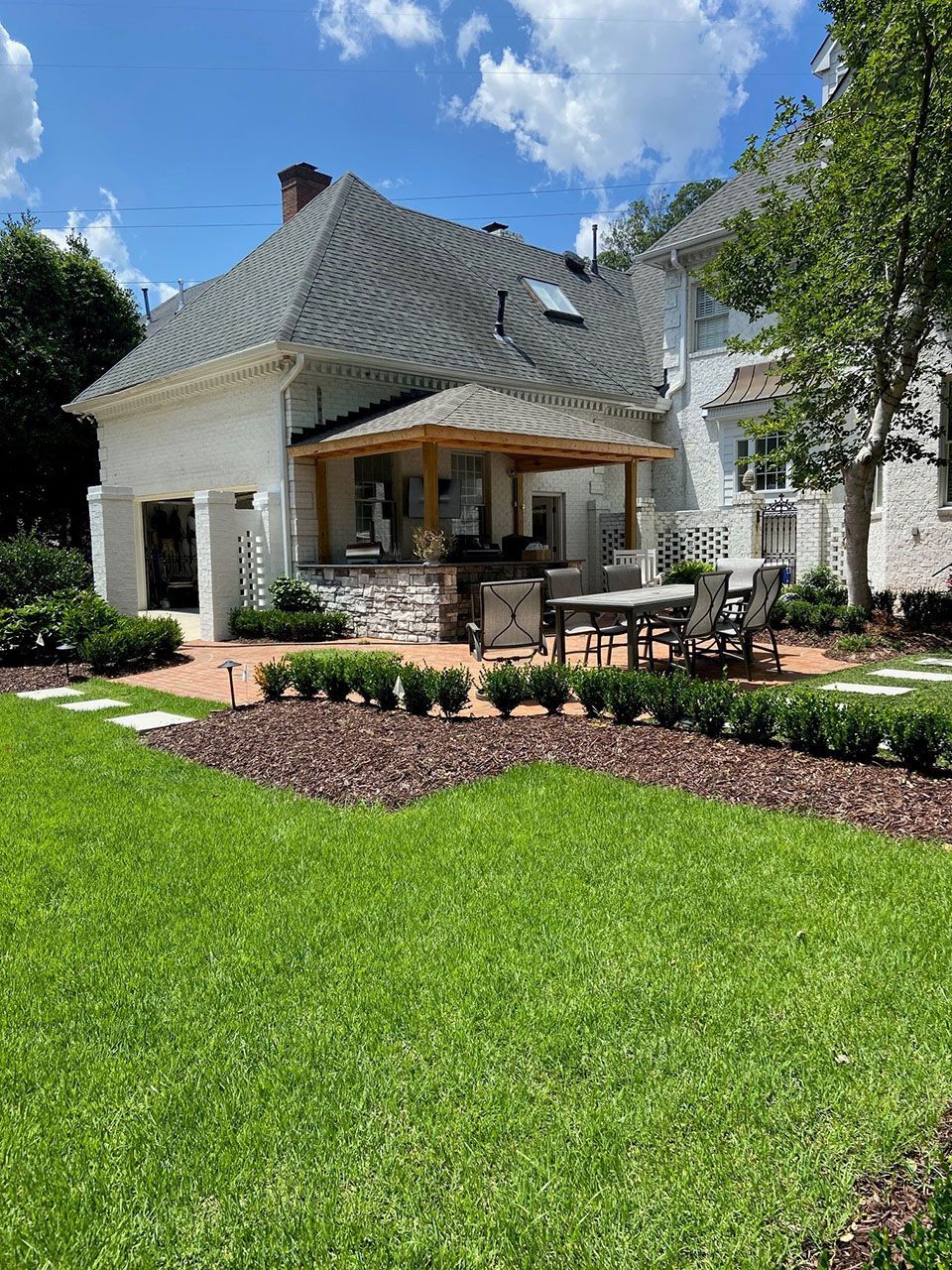 Wide angle view of backyard landscape work from Brookscapes LLC