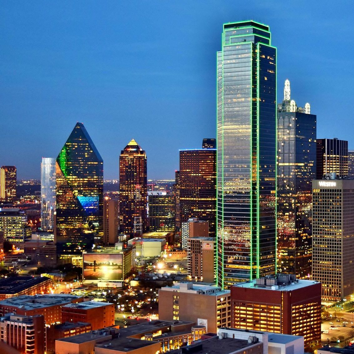 An aerial view of a city skyline at night