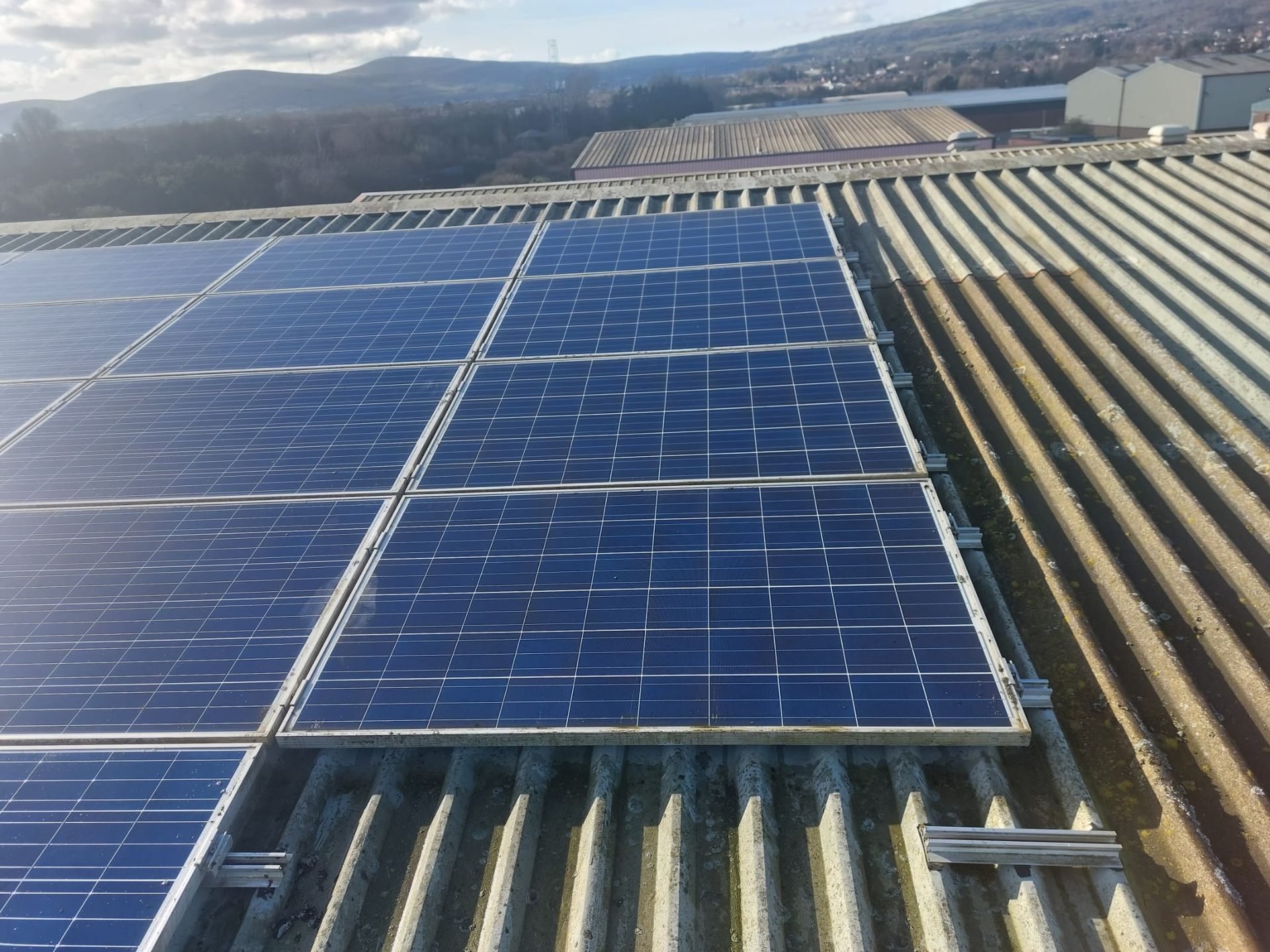 A roof with a lot of solar panels on it