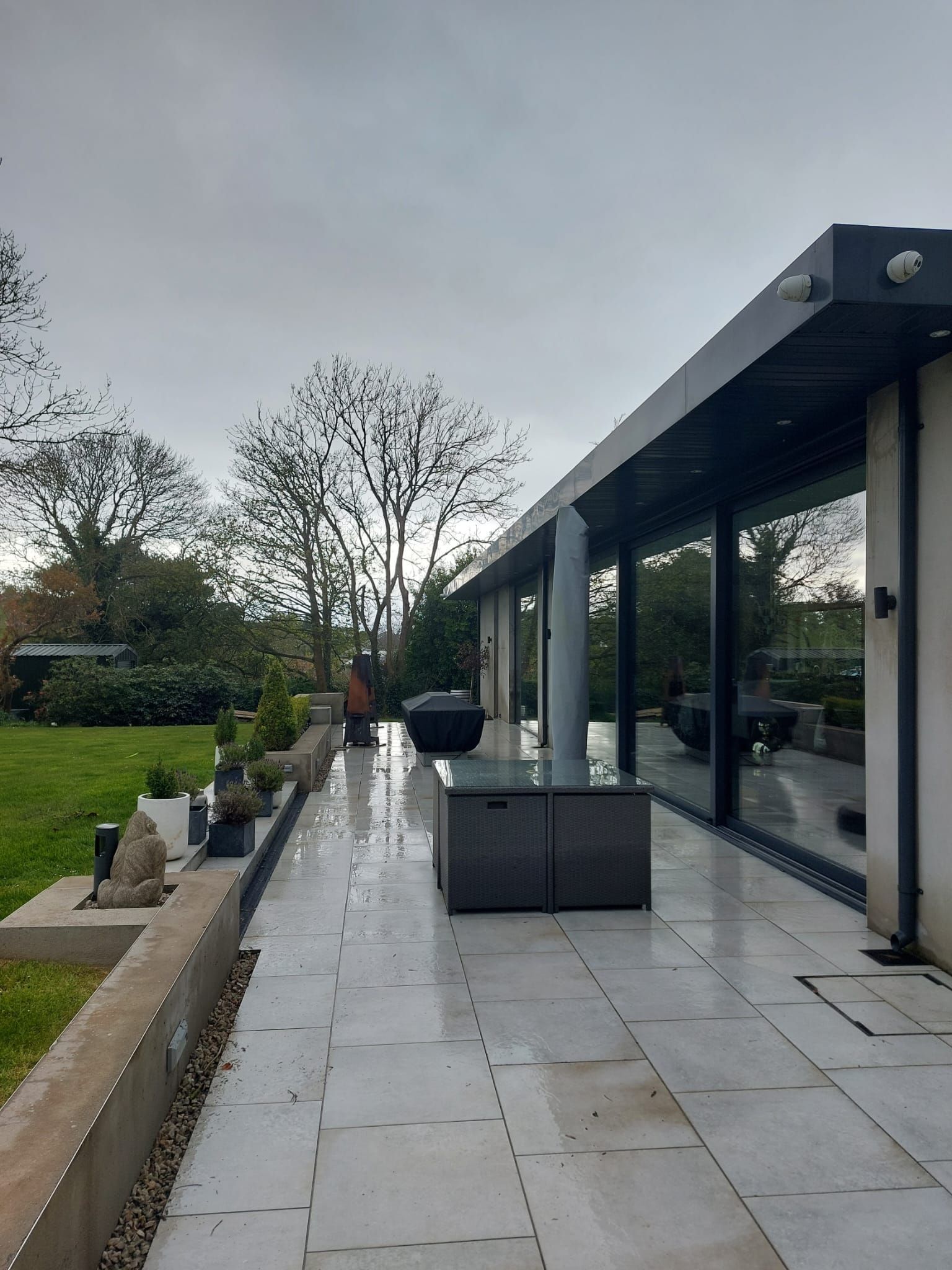 A large house with a large patio in front of it.