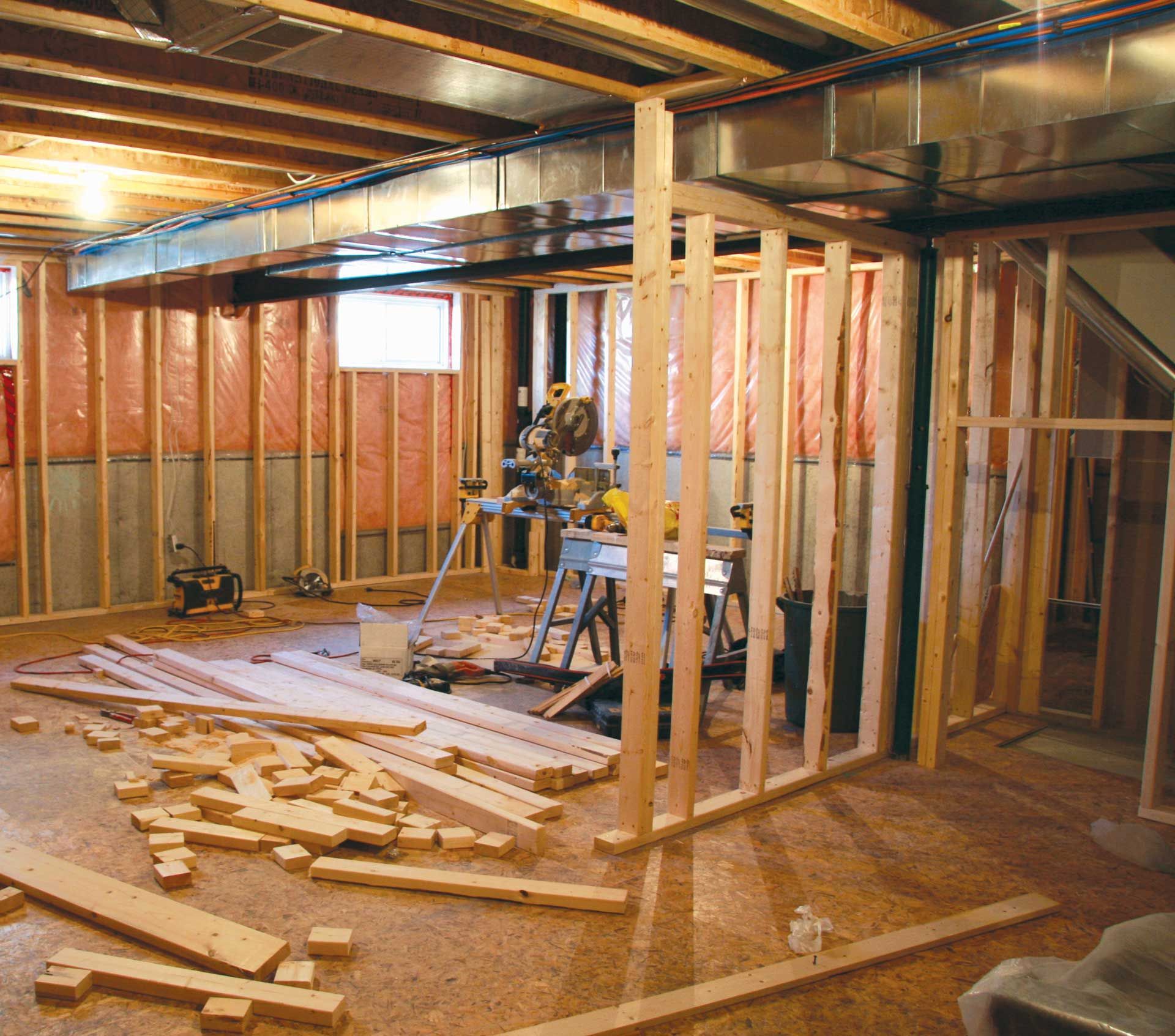 A room that is being built with a lot of wood on the floor