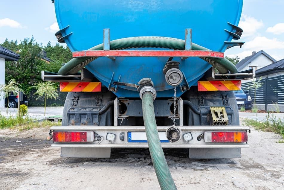 Back of a Tanker Truck With A Hose Attached — Vacuum Excavation in Gympie, QLD