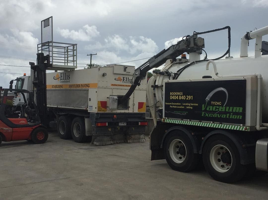 Forklift With a Cage Lift Raised Above a Truck — Vacuum Excavation in Hervey Bay, QLD