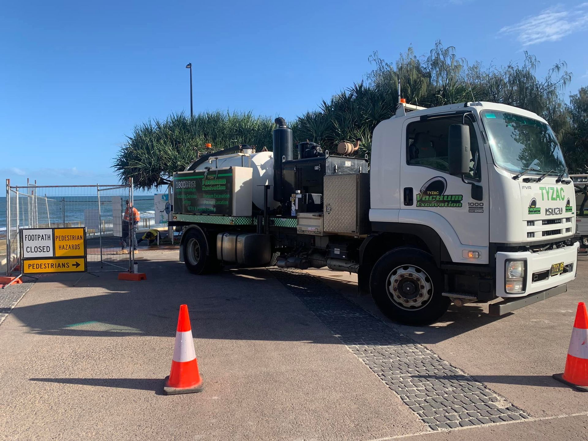 A Truck Parked On The Side Walk