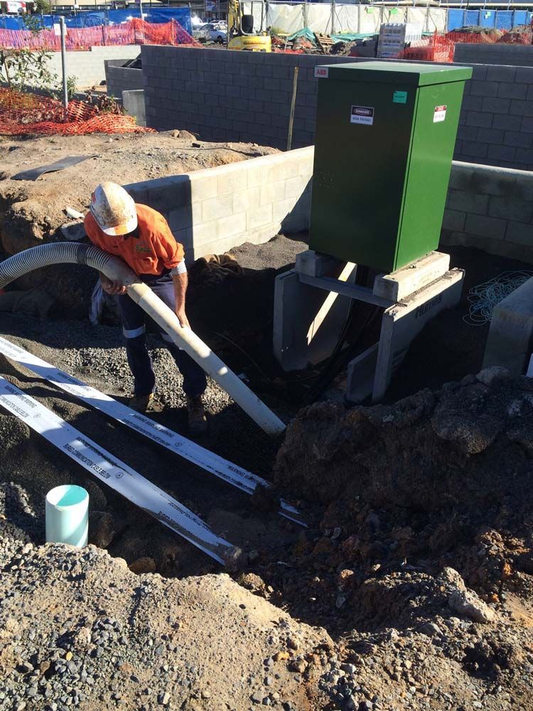 Man Holding A Big Hose For Excavation — Tyzac Vacuum Excavation in Sunshine Coast, QLD
