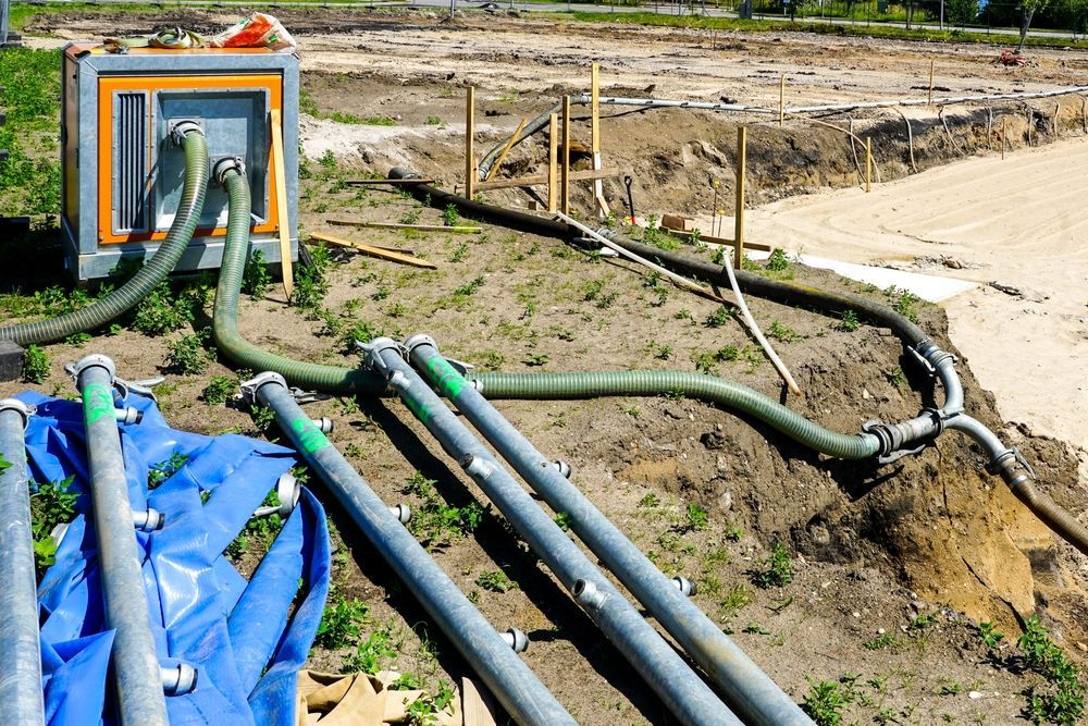 A Large Water Pump With Hose — Vacuum Excavation in South Brisbane, QLD
