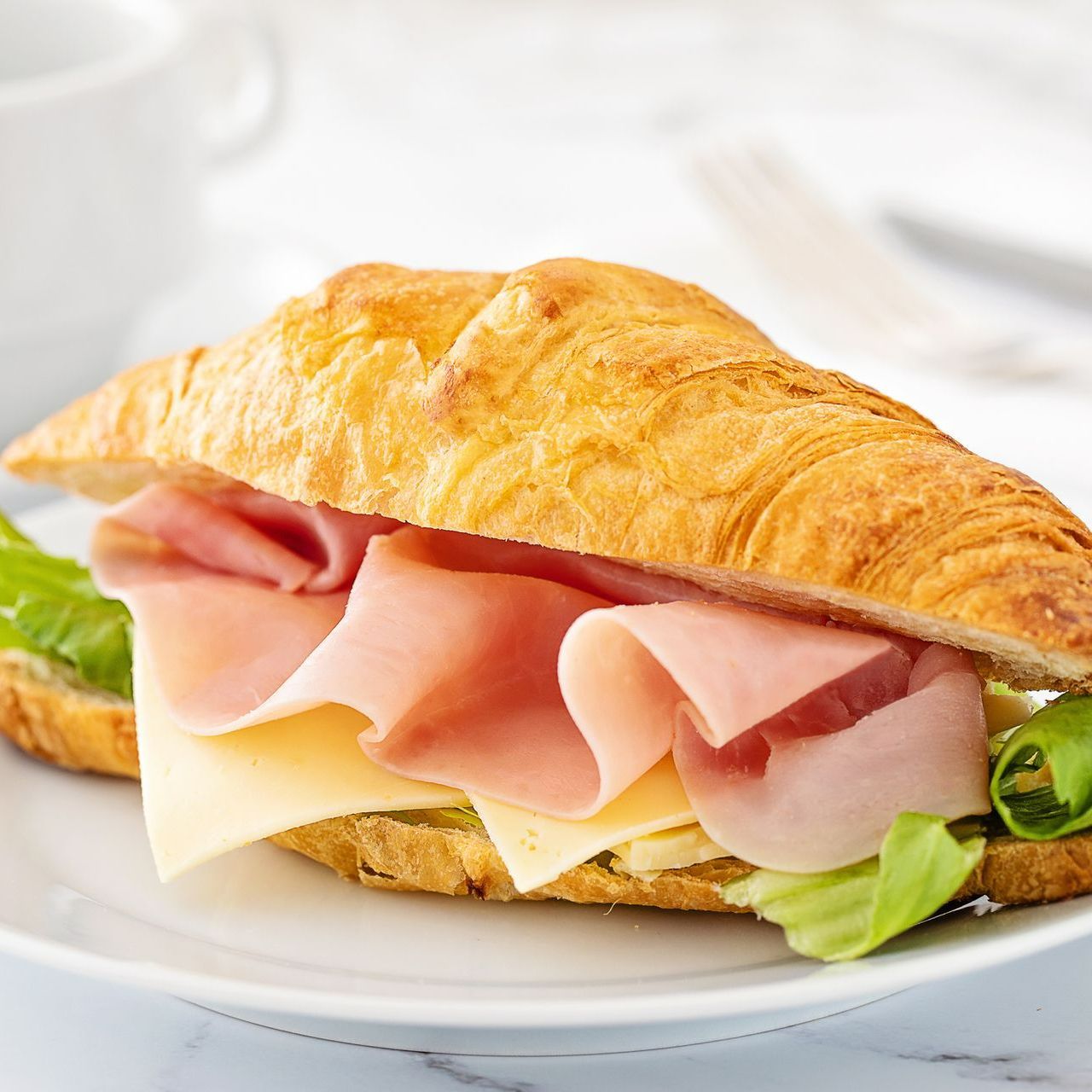A Croissant Sandwich With Ham - Henrico, VA - Napoli Pizza