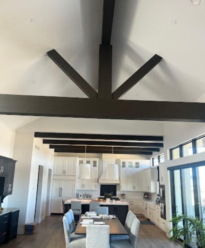 A kitchen with a table and chairs in it