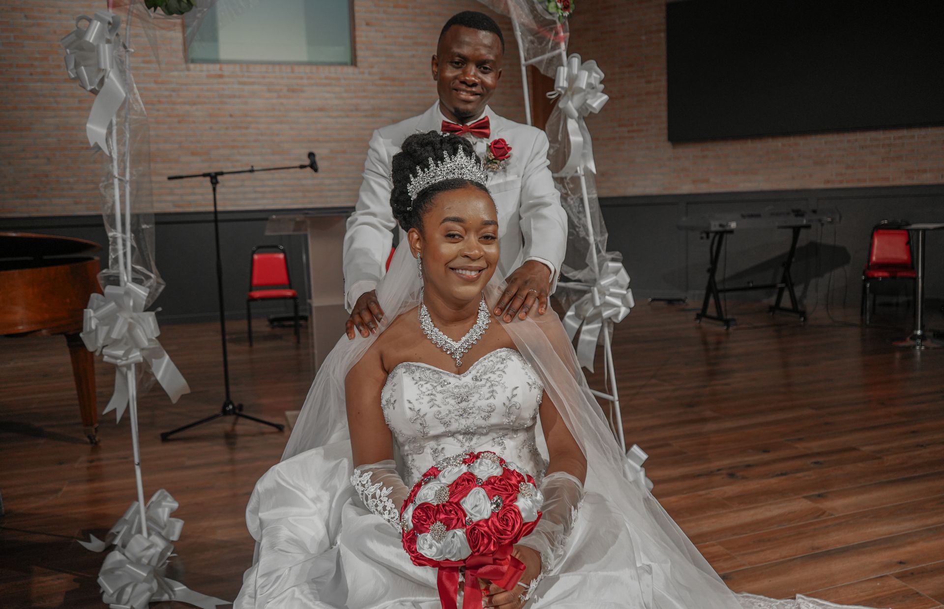 A bride and groom are posing for a picture on their wedding day.