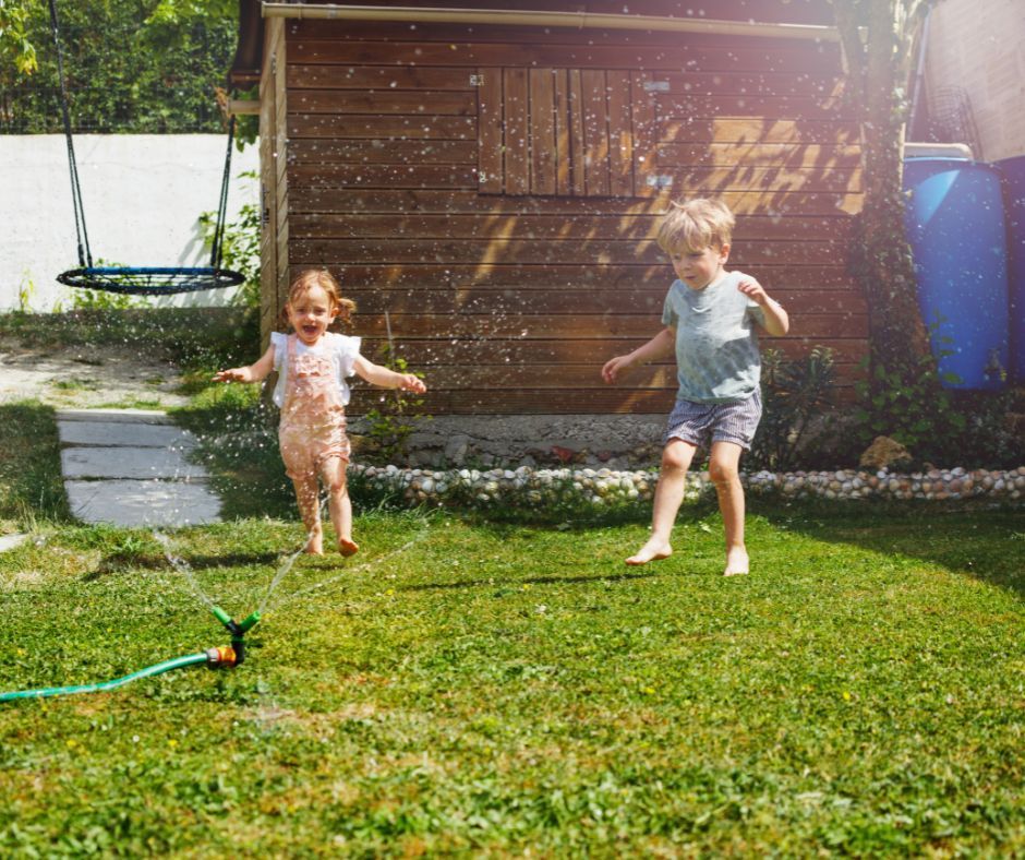 Children playing in the backyard under the summer sun