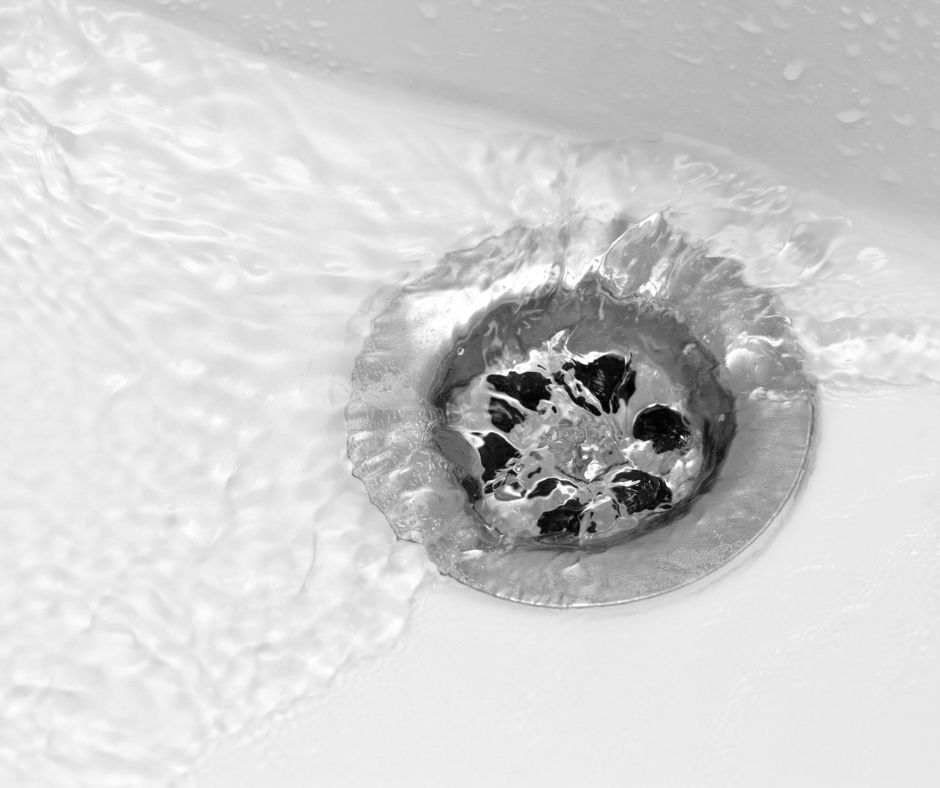 Water swirling around a sink drain.