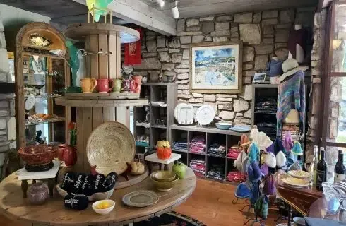 A store filled with lots of ceramics and plates on display.