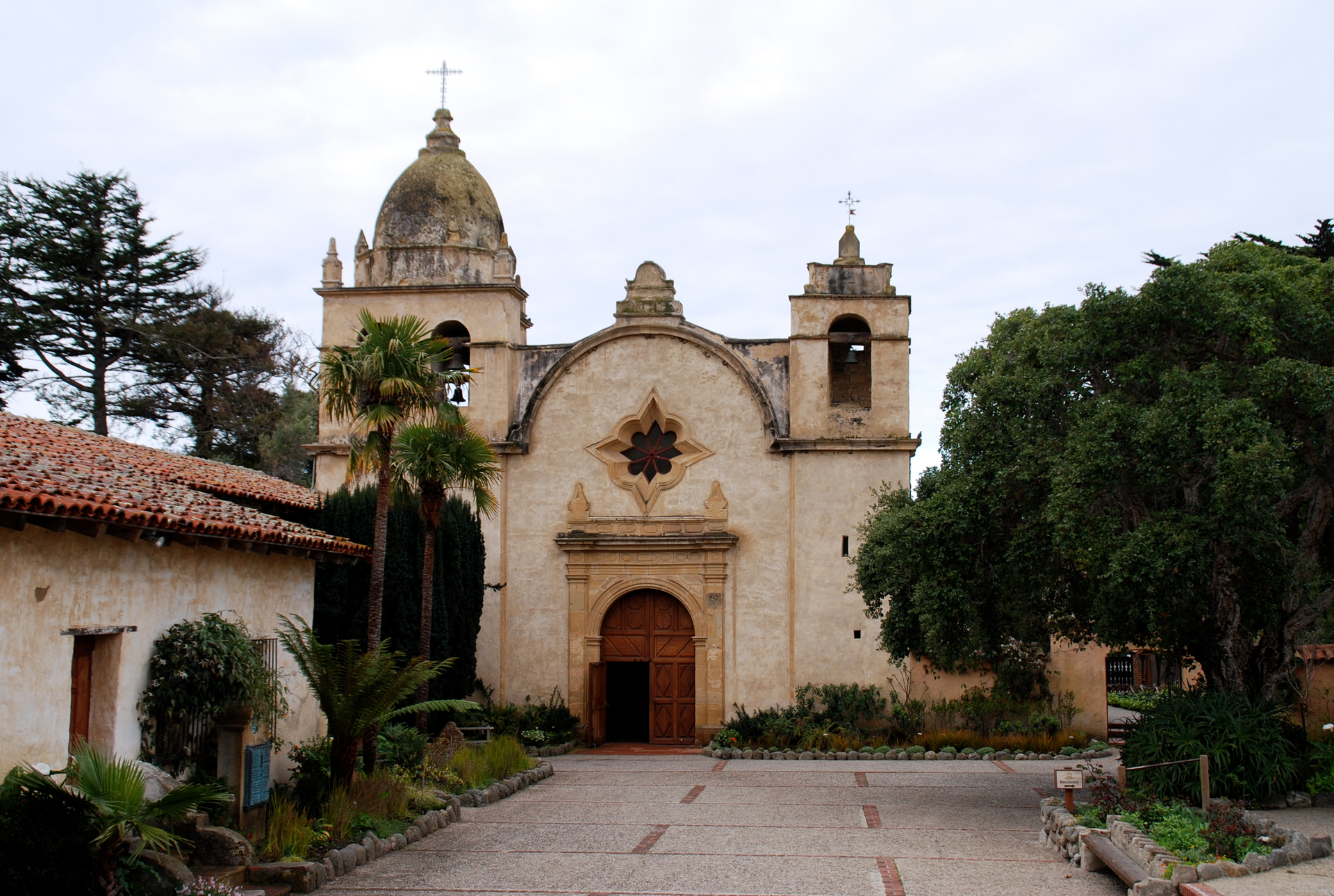A church with a dome and a cross on top of it