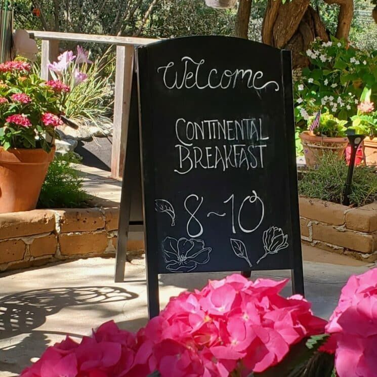 A sign that says welcome continental breakfast on it