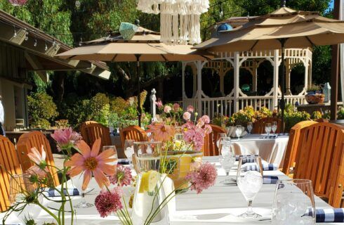 A table with a vase of flowers on it