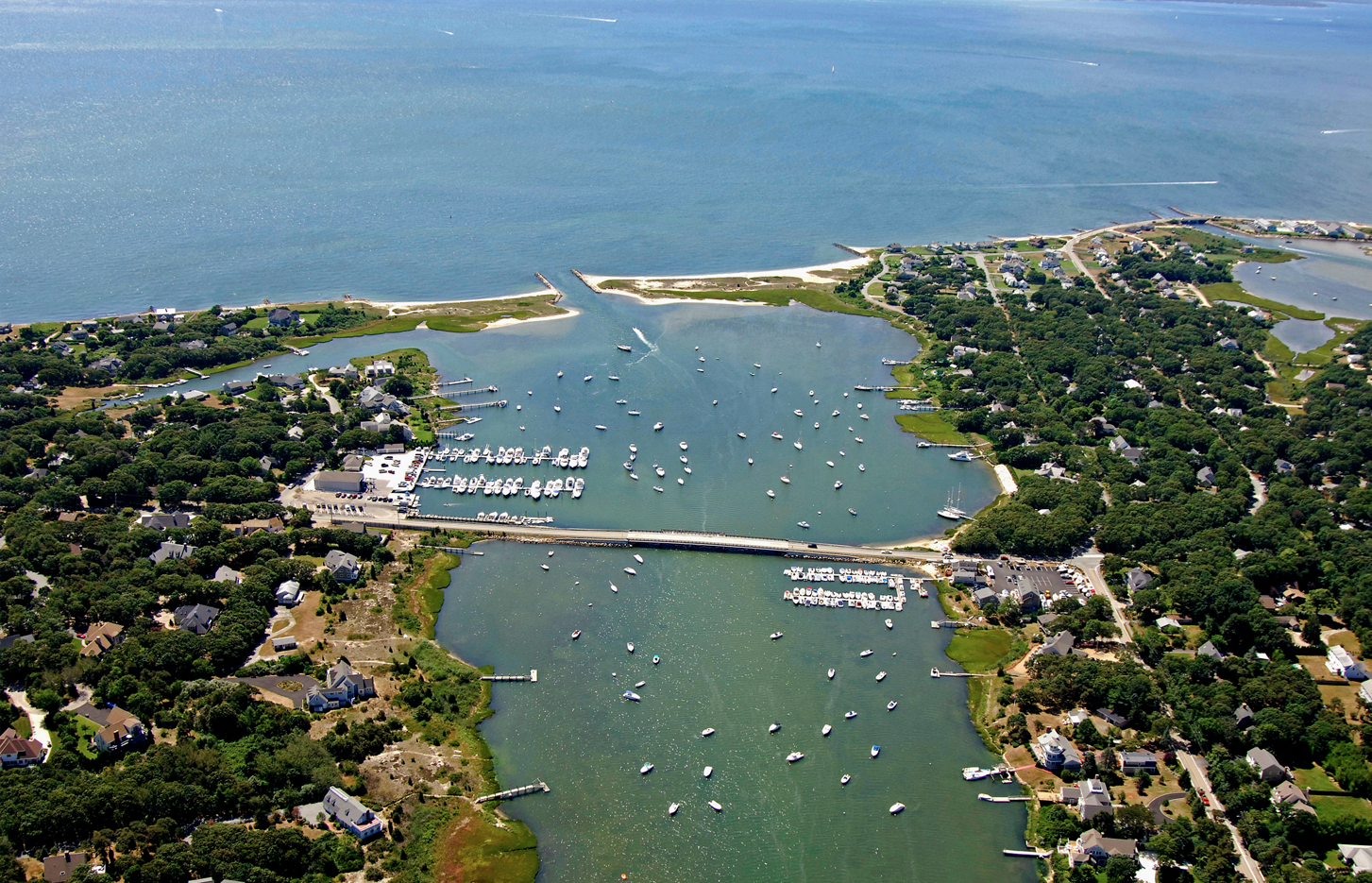 An aerial view of a body of water with boats in it