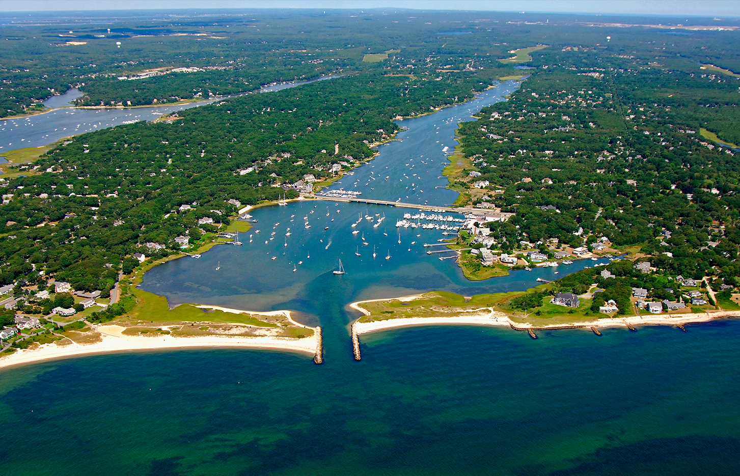 An aerial view of a body of water surrounded by trees