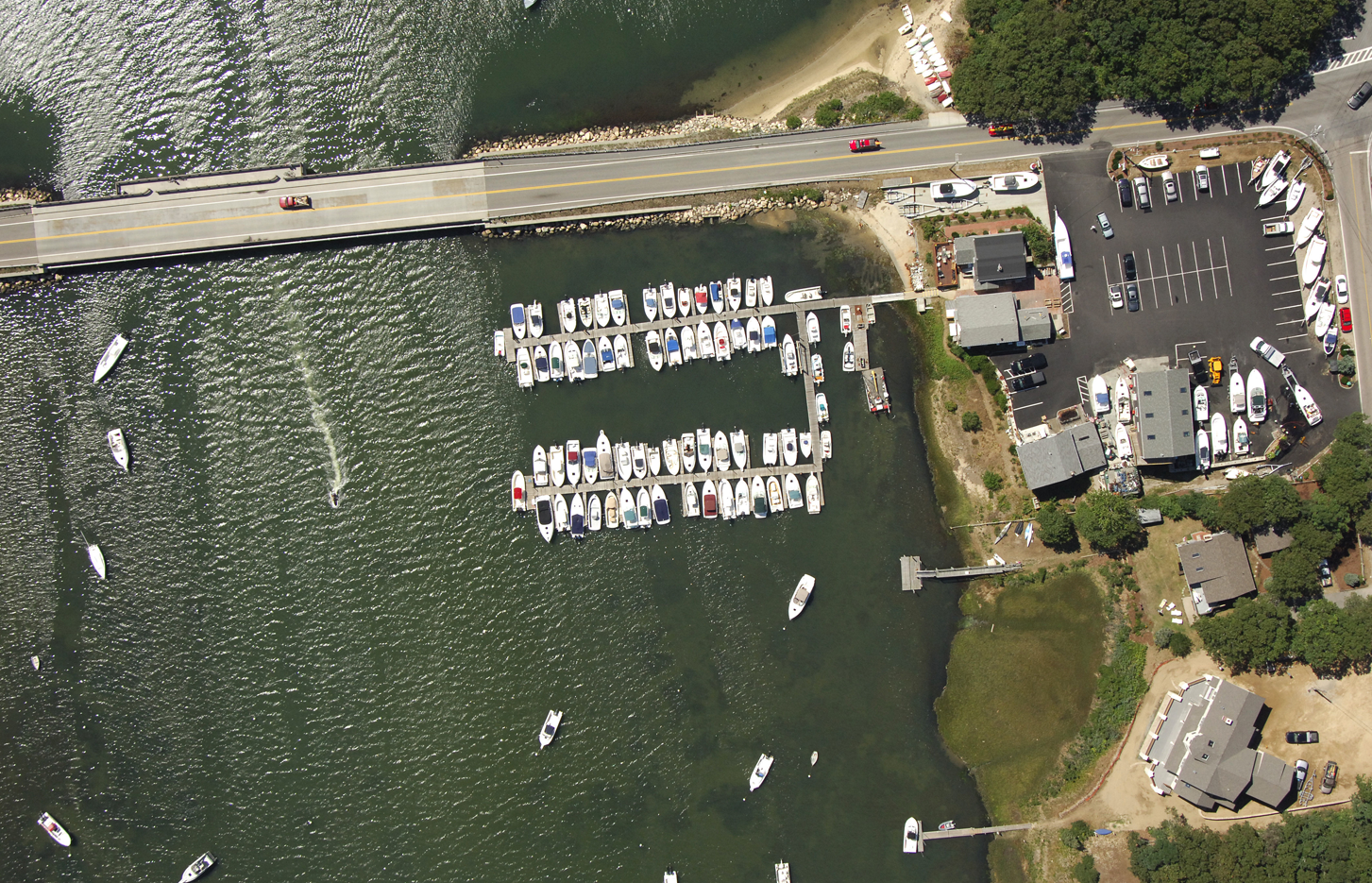 An aerial view of a marina with many boats docked