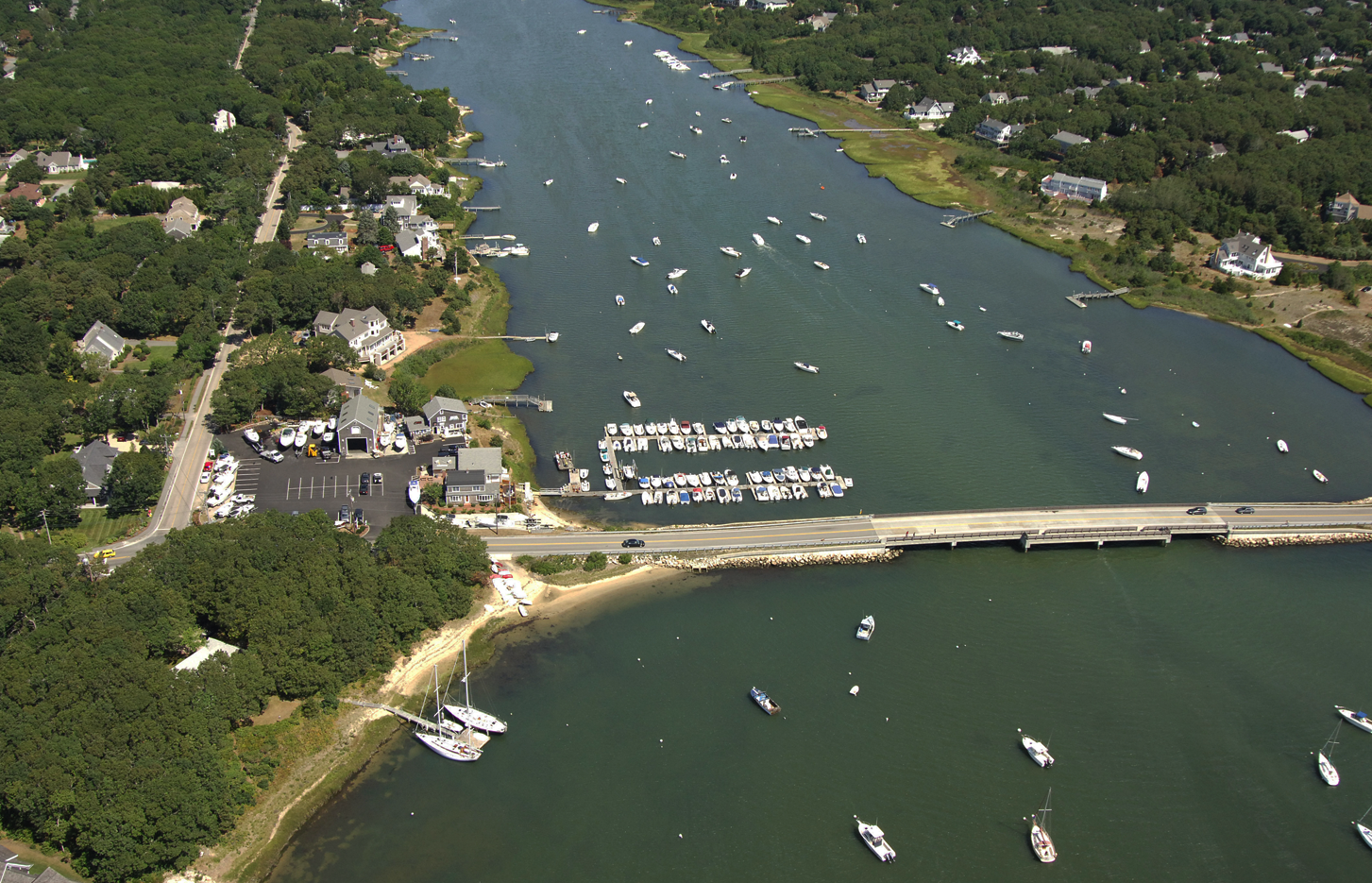 An aerial view of a river with many boats in it