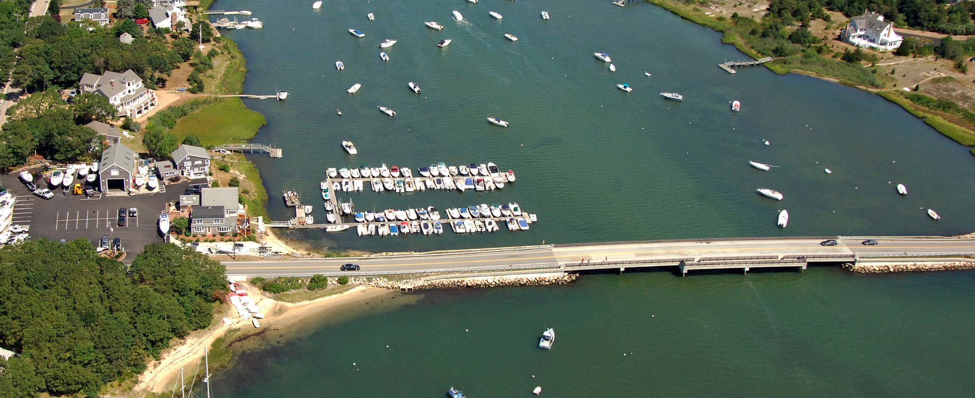 An aerial view of a body of water with boats in it