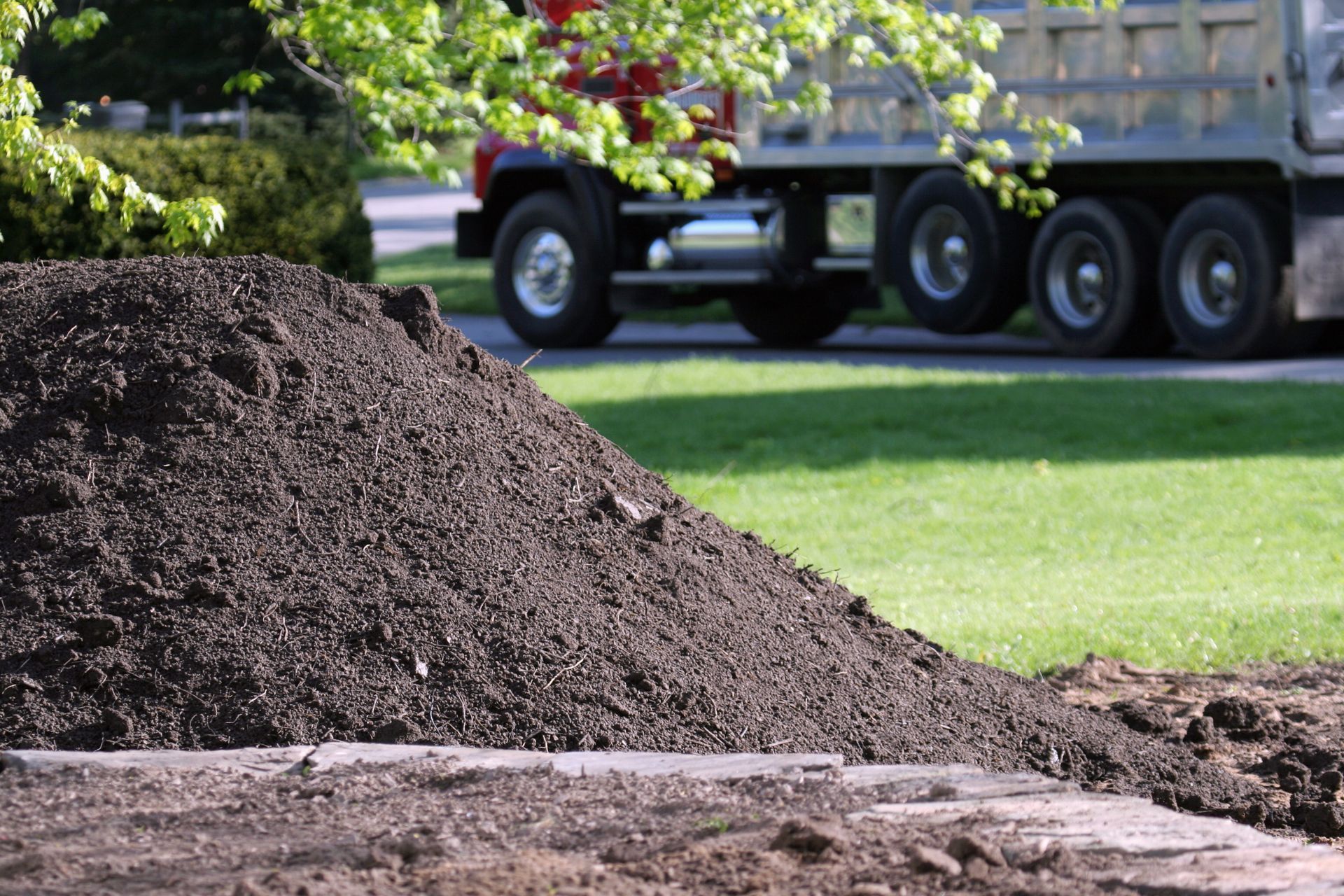 a little mountain of topsoil in a residential landscaping