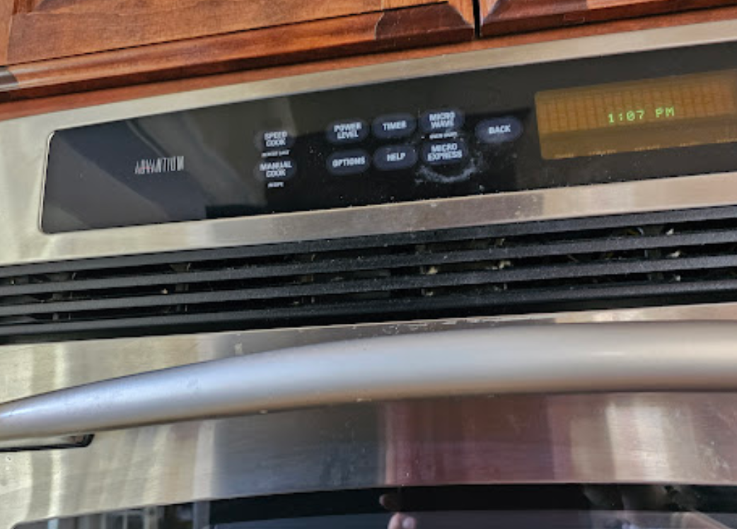 A close up of a stainless steel oven in a kitchen.