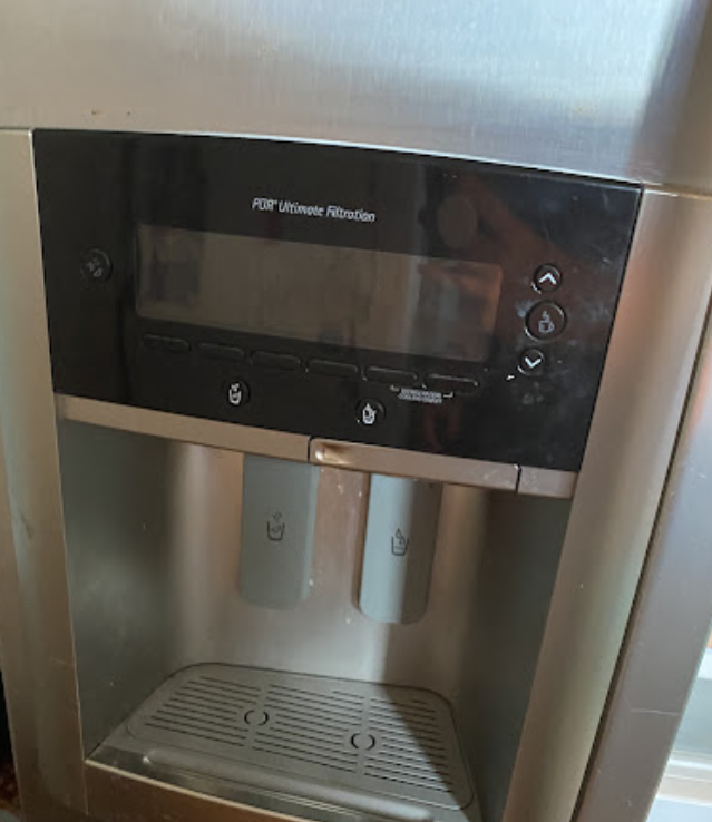 A stainless steel refrigerator with an ice maker