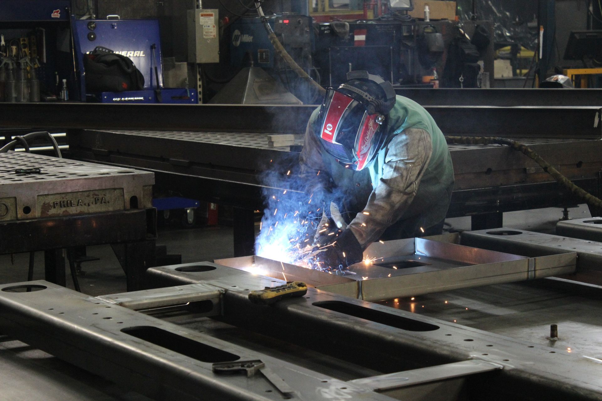 Welder performing metal fabrication at United Alloy factory.