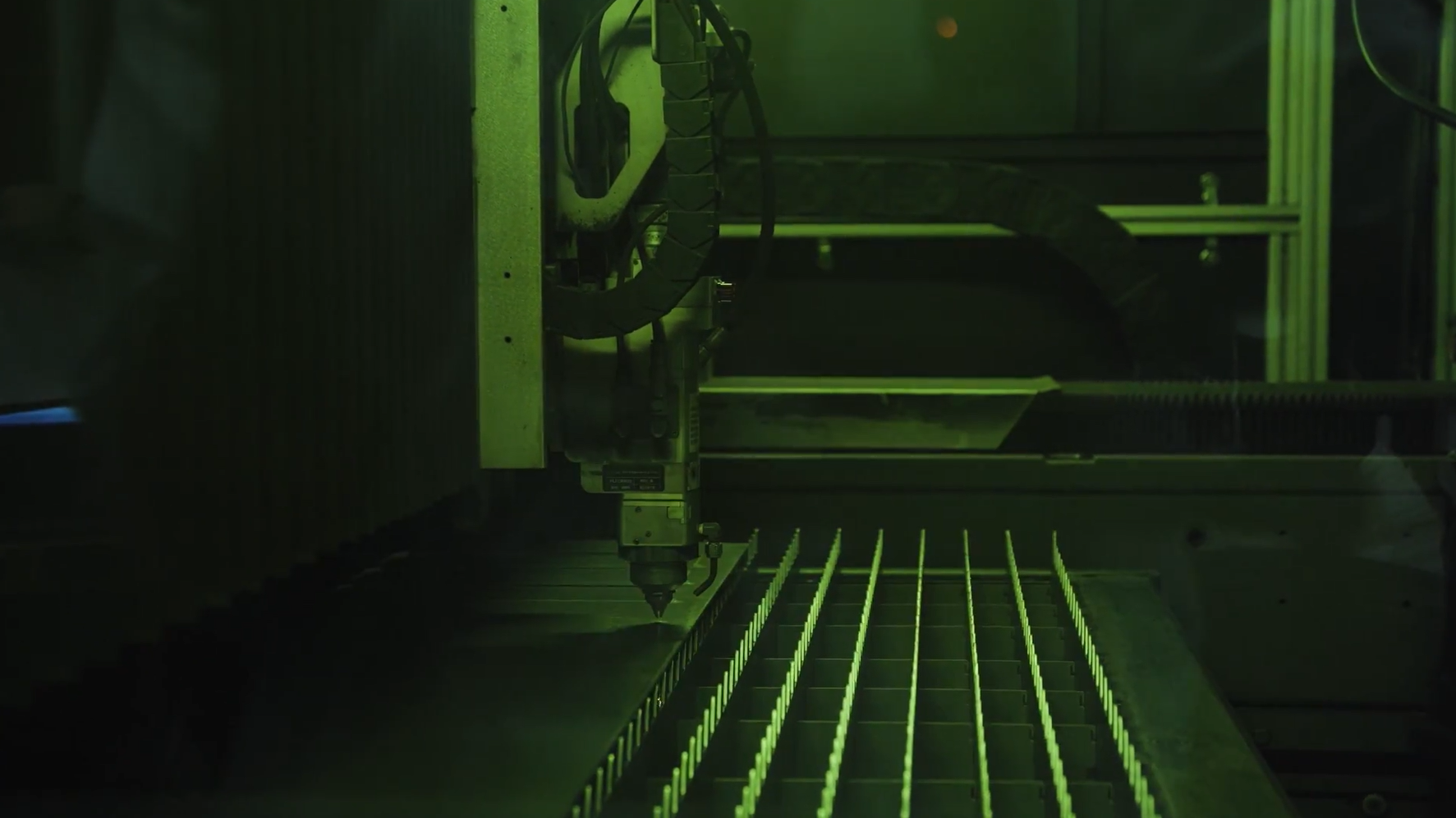 Laser cutting head used in metal fabrication at United Alloy.