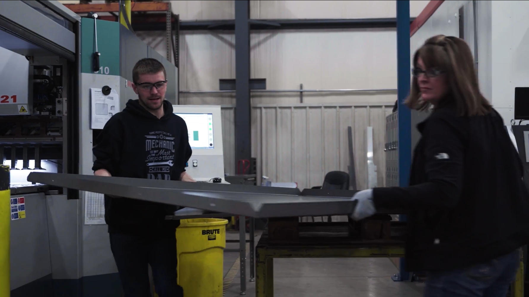 Material handler moving raw materials at United Alloy manufacturing facility.