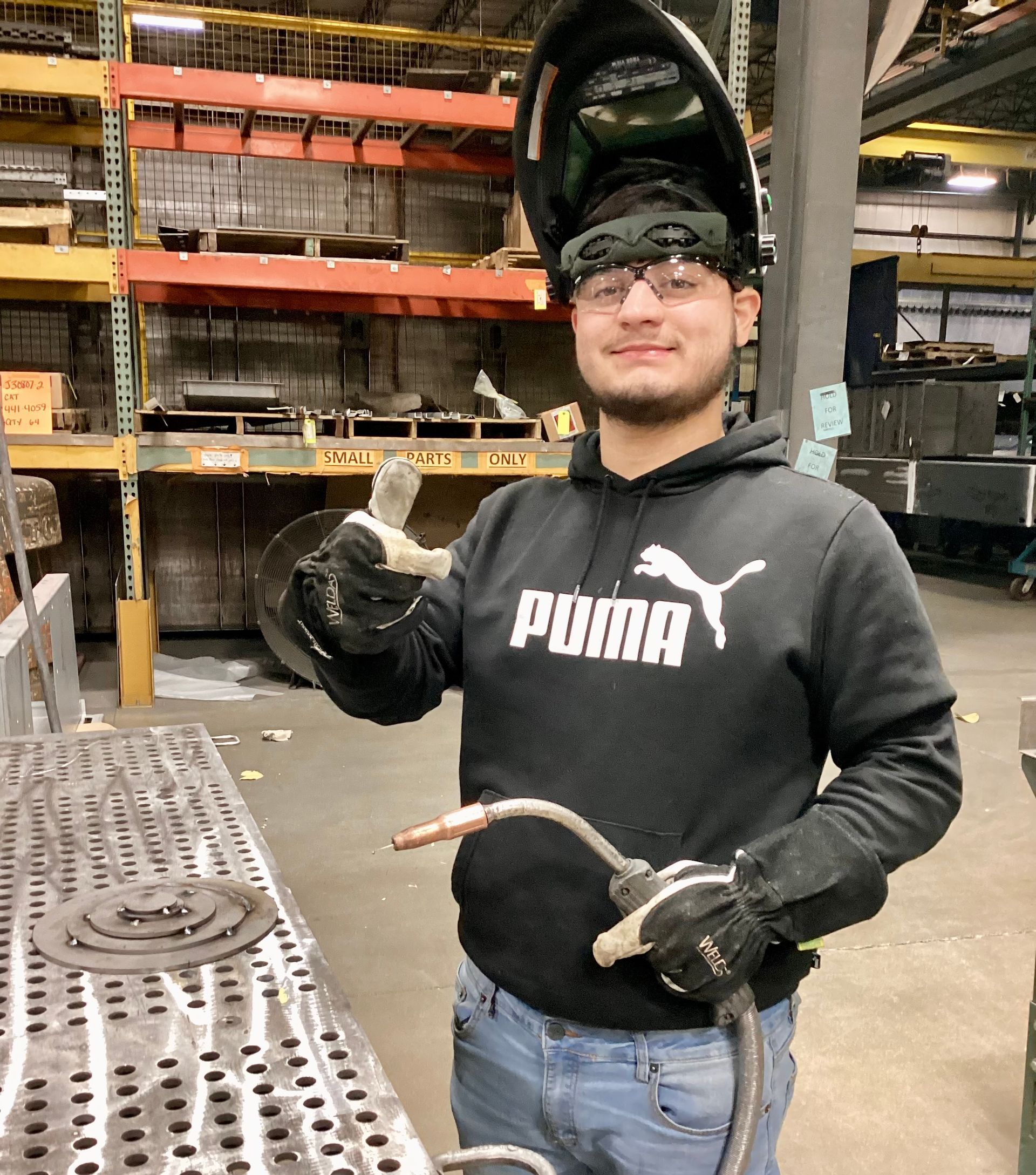 High school youth welding as part of United Alloy’s apprenticeship program.
