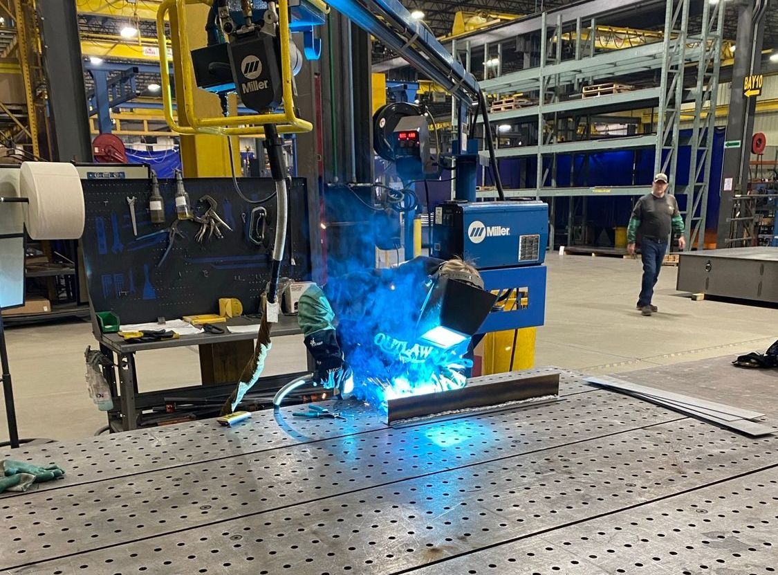 High school youth welding as part of United Alloy’s apprenticeship program.