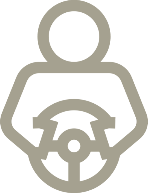 A man is holding a steering wheel in his hands.