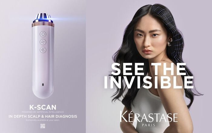 A woman with long hair is standing next to a k-scan device.