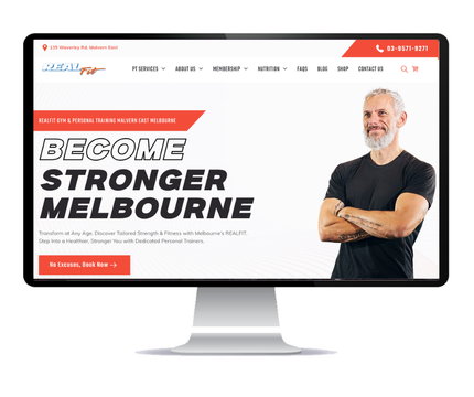 Desktop monitor displaying the RealFit a personal training website, which Social Space designed.