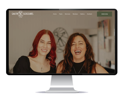 Desktop monitor displaying the Salty Scissors (hair salon) website, which Social Space designed.