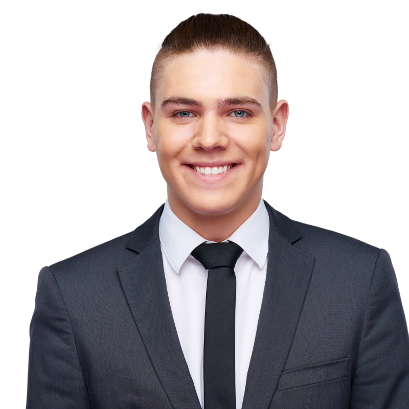 A man in a suit and tie is smiling for the camera