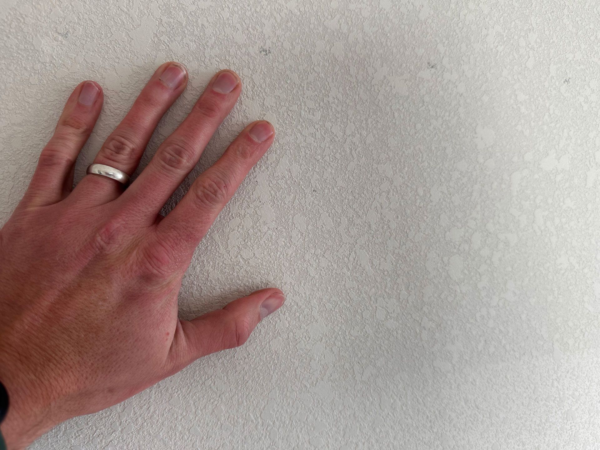 Man Holding Wall | Springfield, MO | The FinishingTouch Drywall