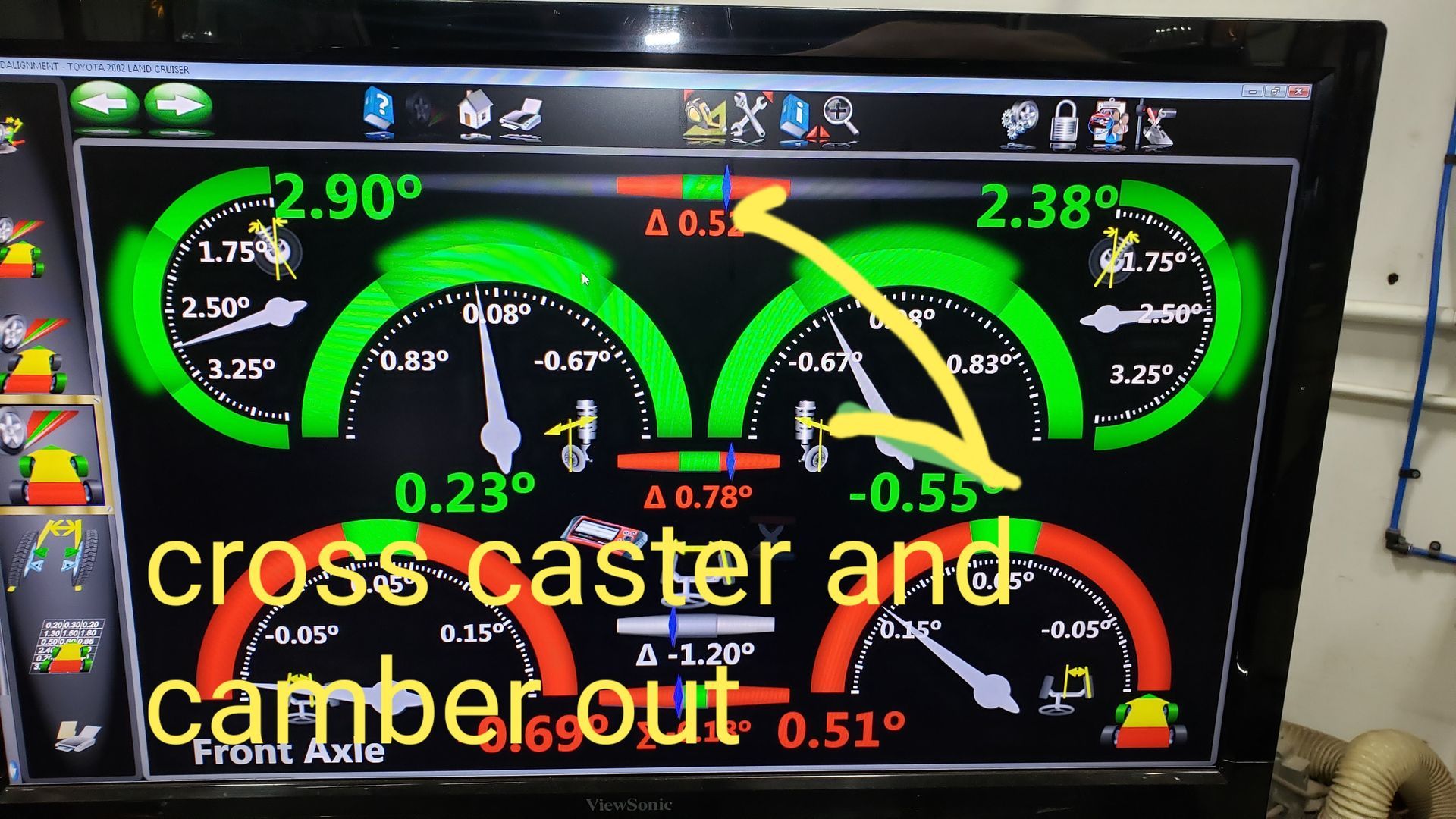 Alignment machine screen displaying car's caster and camber. Green and red gauges show measurements and an arrow.