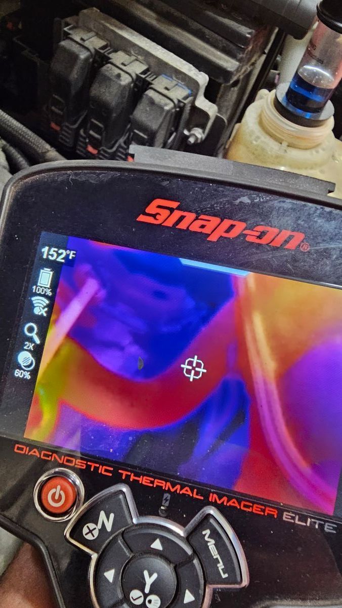 Snap-on thermal imager showing heat signature in engine bay, displaying temperature of 152°F. | Accomplished Automotive