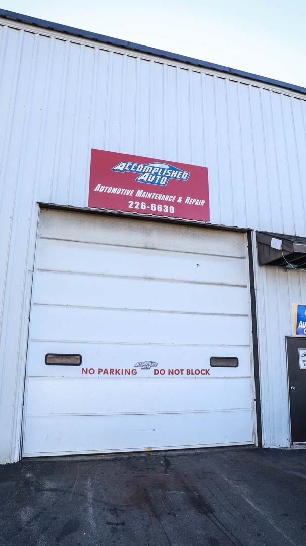 White building with red sign: 