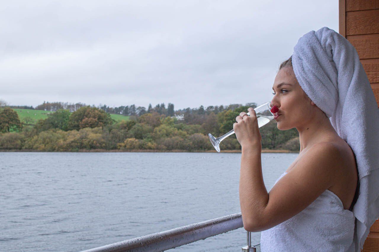 Drinking champagne overlooking Auchenreoch Loch