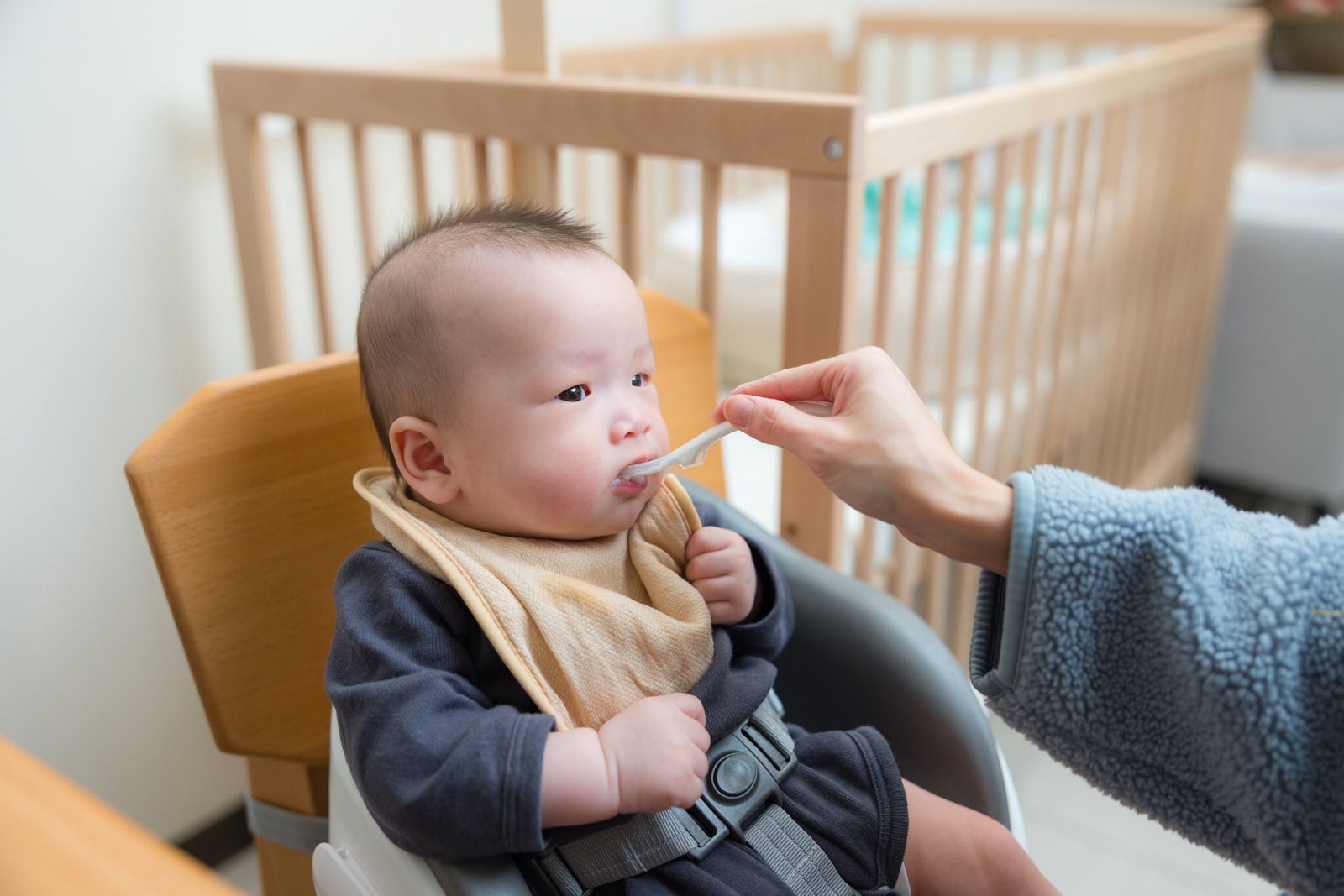 Sunset over silhouetted buildings, with orange and gray clouds.