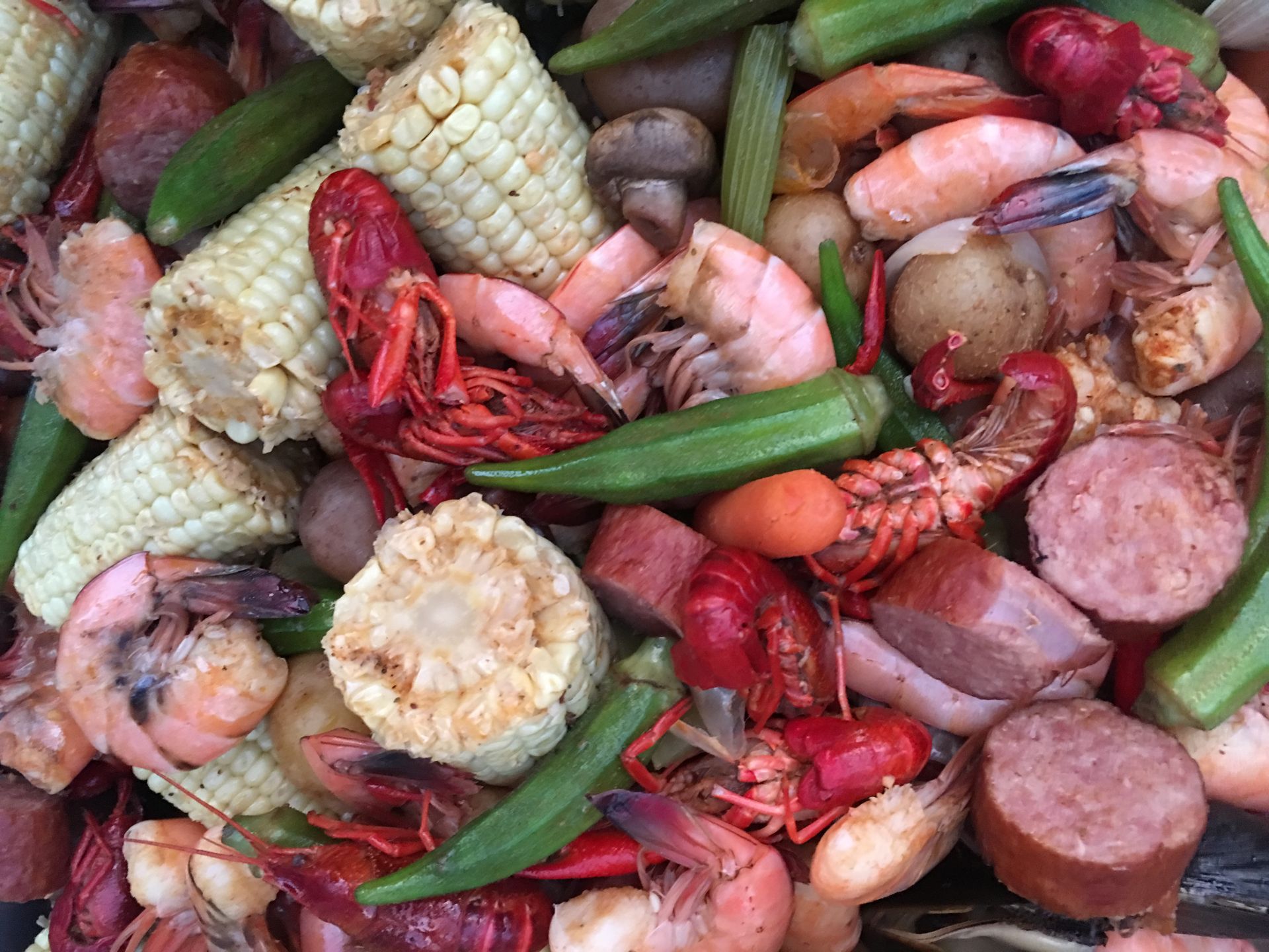 Lowcountry seafood boil: shrimp, crawfish, corn, sausage, potatoes, and okra.