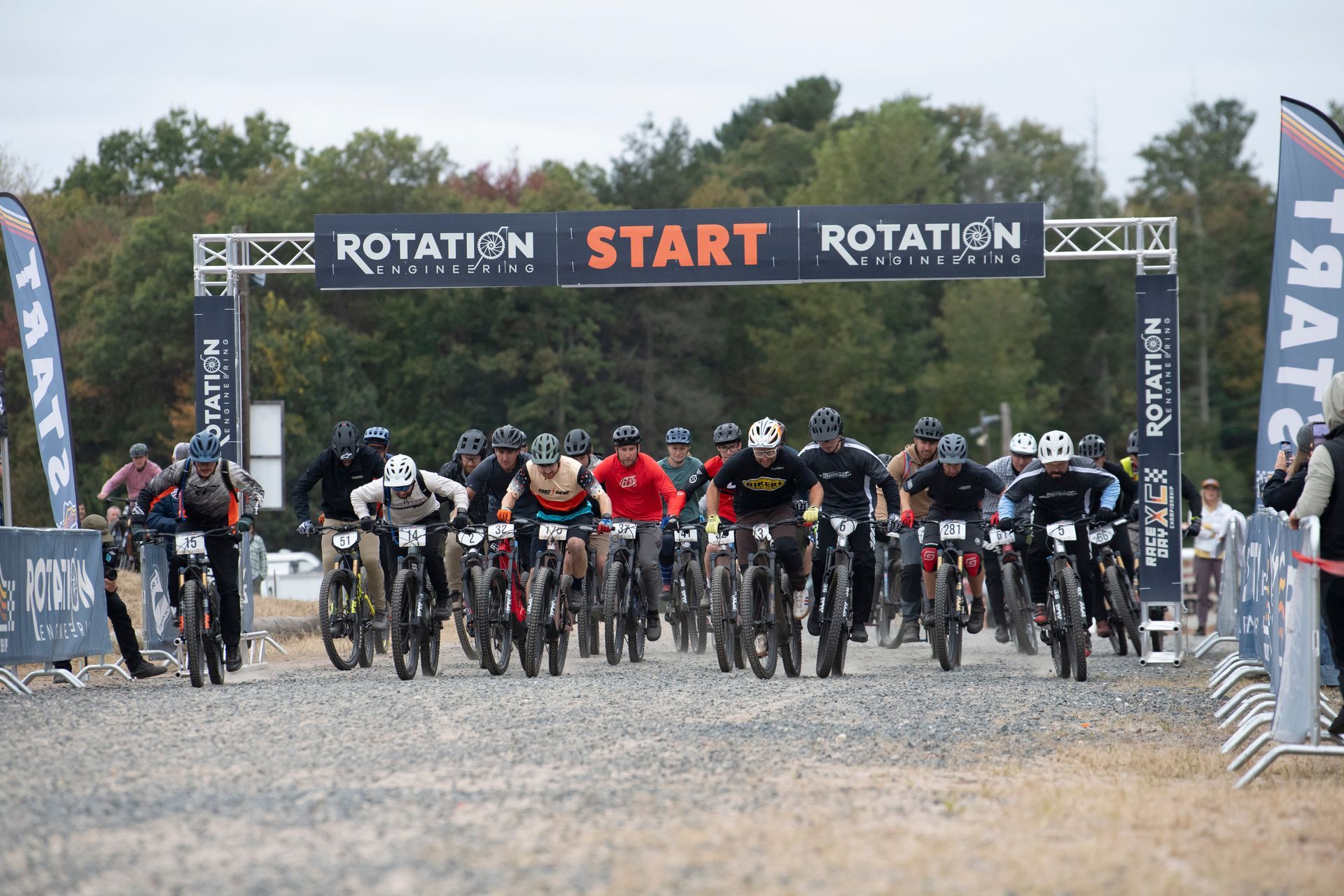 Mountain bikers at the starting line of a race under a 