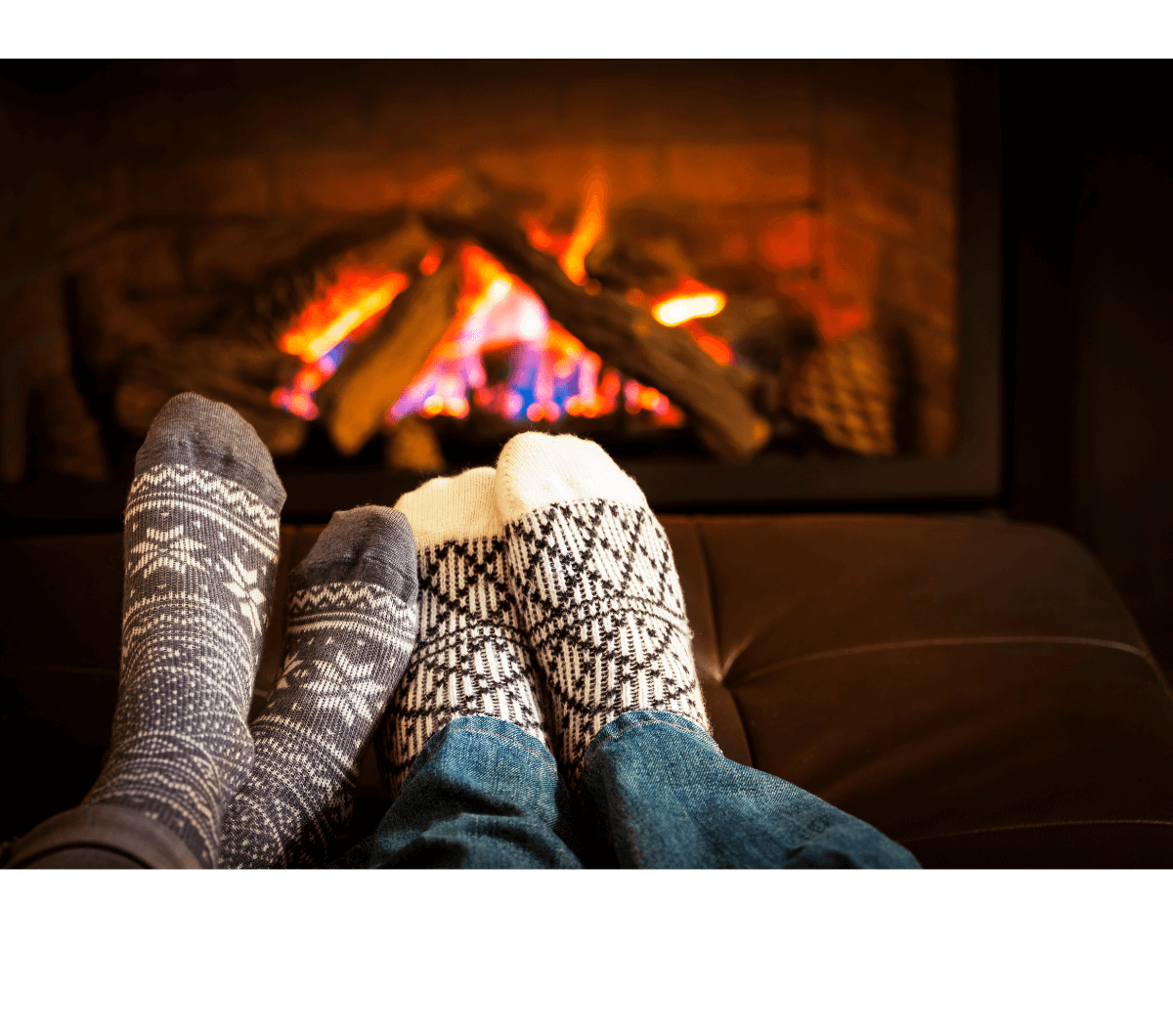 couple enjoying a warm fire place 