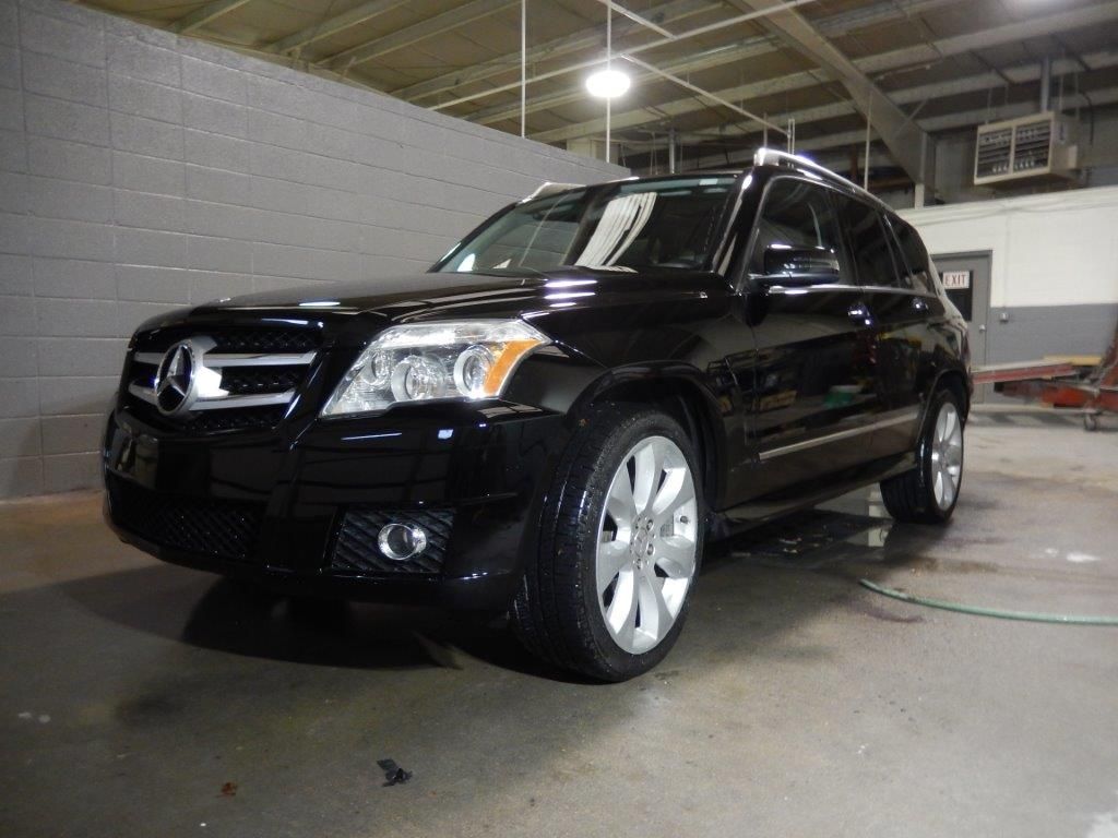 Black Mercedes-Benz SUV parked inside a garage, angled slightly towards the camera.