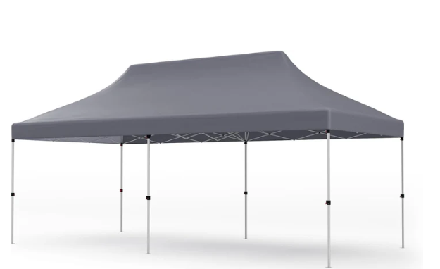 A gray tent is sitting on top of a white surface.