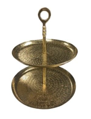 A gold two tiered tray with a handle on a white background