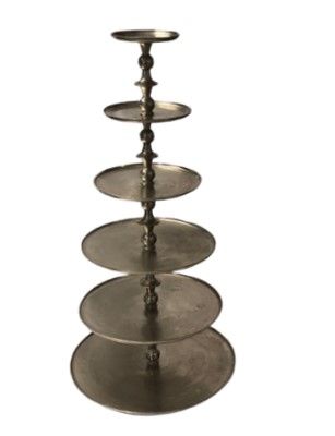 A stack of metal plates on a white background